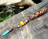 Side view of Bohemian Loc Bead on a wooden background.