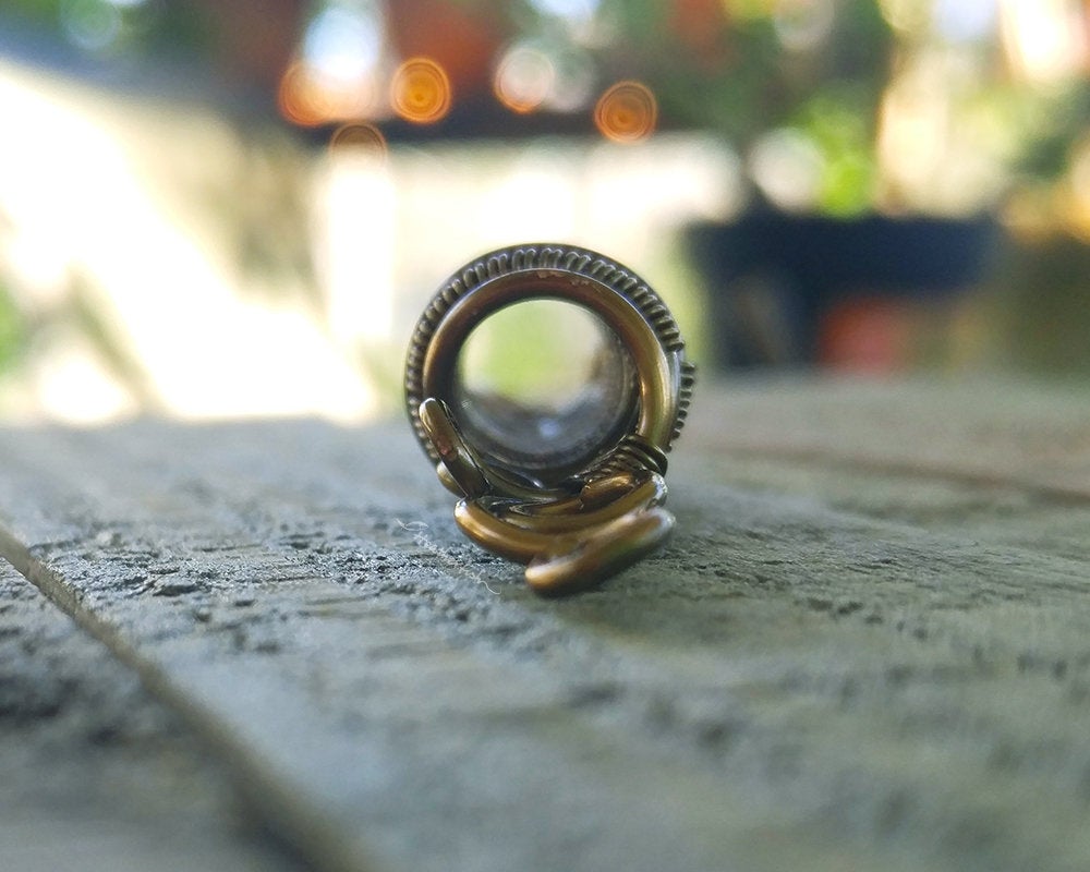 A close up front view of a Fancy Woven Filigree Dread Bead.