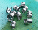 A top view of Stylized Aluminum Dread Beads a set of 10.