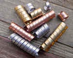 A top view of Mixed Metal Dread Beads Set of 10 in Varied length.