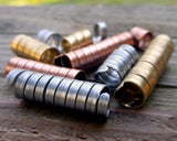 A side view of Mixed Metal Dread Beads Set of 10 in Varied Length.