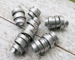 A close up view of Organic Style Dread Beads a Set of 5.
