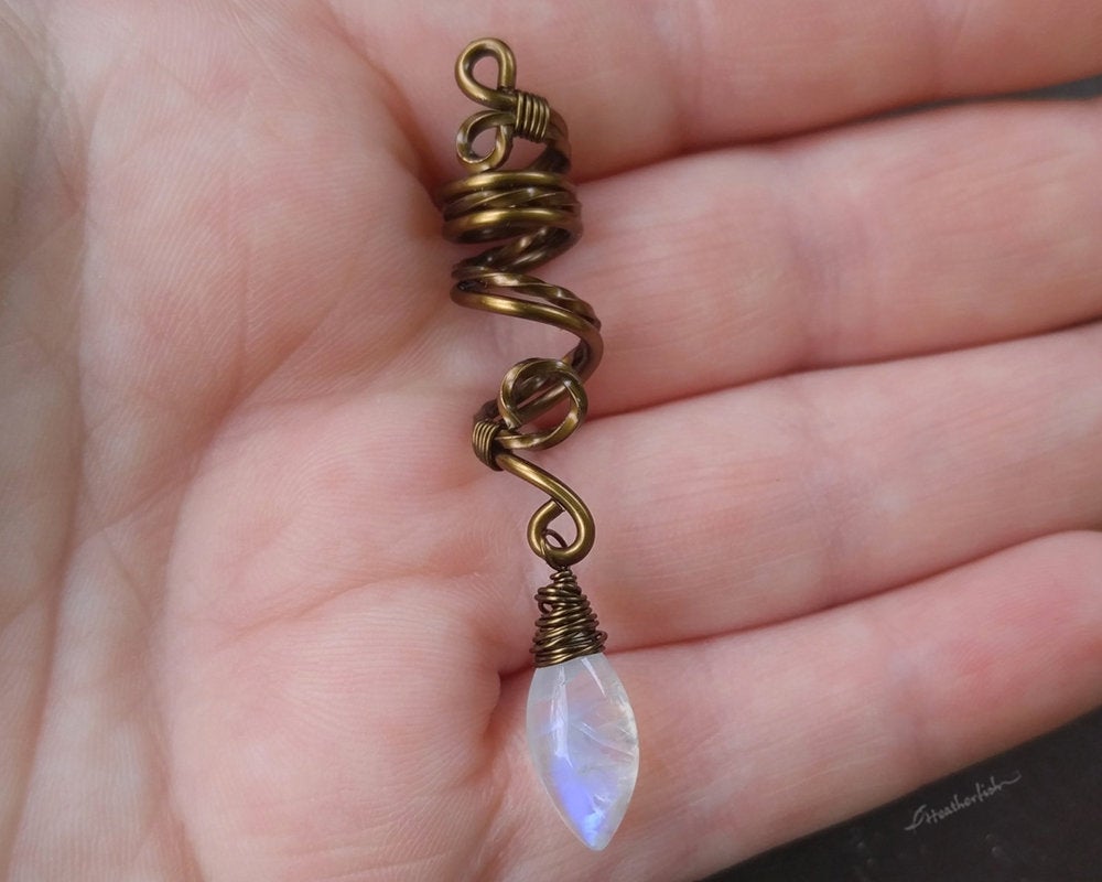 A top view of the Moonstone Loc Bead in hand.