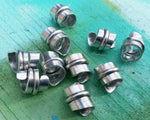 A side view of Stylized Aluminum Dread Beads a Set of 10.
