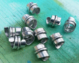 A side view of Stylized Aluminum Dread Beads a Set of 10.