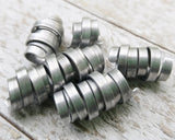 A side view of Organic Style Dread Beads a Set of 5.