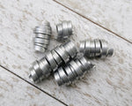 A top view of Organic Style Dread Beads Set of 5.