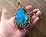 A top view of a Huge Labradorite Statement Piece in hand.