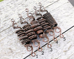 A top view of One Copper Dread Bead in different styles.