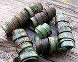 A close up view of Patina Copper Dread Beads Set of 6.