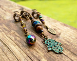 A close up of Hamsa Loc jewelry set of 3.