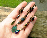 A top view of Hamsa Loc jewelry Set of 3 in hand. 