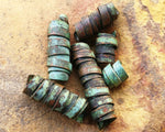 A top view of Patina Copper Dread Beads Set of 6.