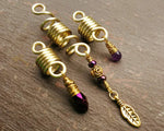 A back view of Gold Amethyst Dread Beads set of 3.