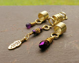 A close up view of Gold Amethyst Dread Beads Set of 3.