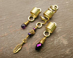 A front view of Gold Amethyst Dread Beads Set of 3.