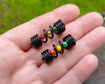 A top view of One Rasta Dread Bead with options of a Glass Bead Type in hand.