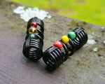 A side view of One Rasta Dread Bead with option in Glass Bead Type.
