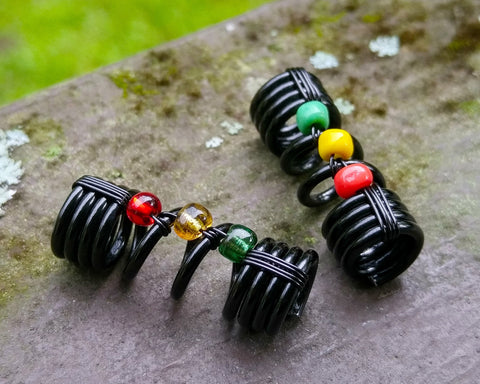 A top view of One Rasta Dread Bead with options in Glass Bead Type.