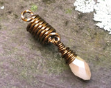 A top view of a Champagne, Antique Brass Dread Bead