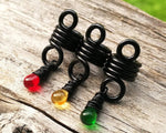 Close up view of Rasta Dread Beads Set of 3 Glass Drops.