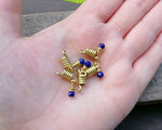 A top view of Lapis Lazuli Sister Loc Beads Set of 5 in hand.