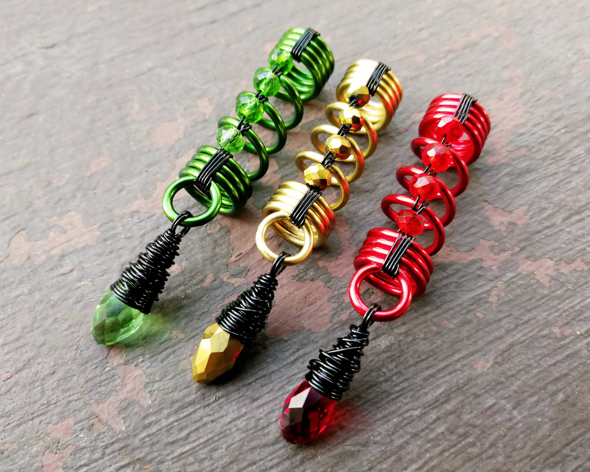 A close up view of Multi-tone Rasta Dread Beads Set of 3.