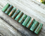 A roll view of Green Patina Copper Tube Beads.