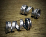 Photo of two hammered aluminum dread bead coils