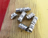 A back view of Hammered Dread Beads Set of 6.