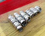 A roll of Hammered Dread Beads Set of 6.